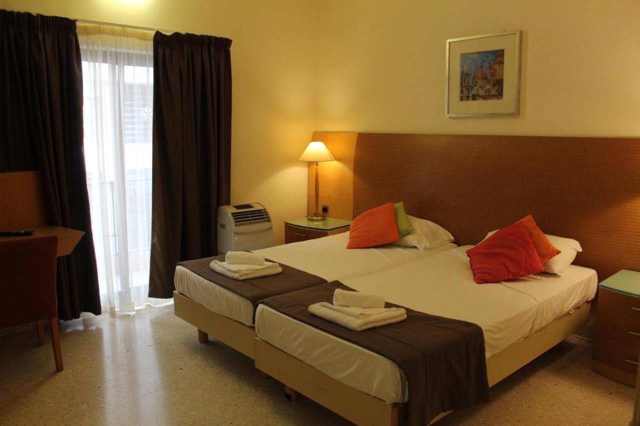Huli Hotel & Apartments Qawra Extérieur photo