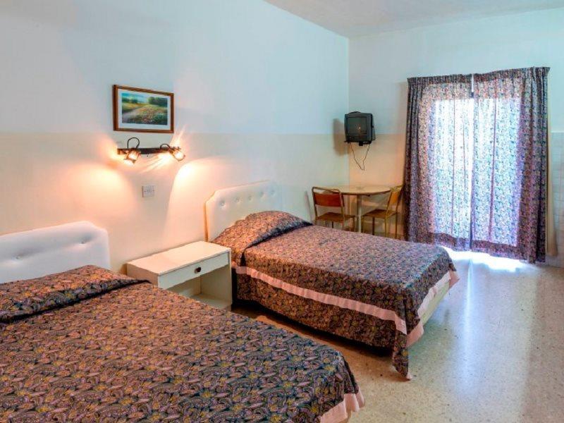Huli Hotel & Apartments Qawra Extérieur photo